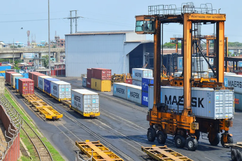 A straddle carrier moving containers at the Port of Chittagong